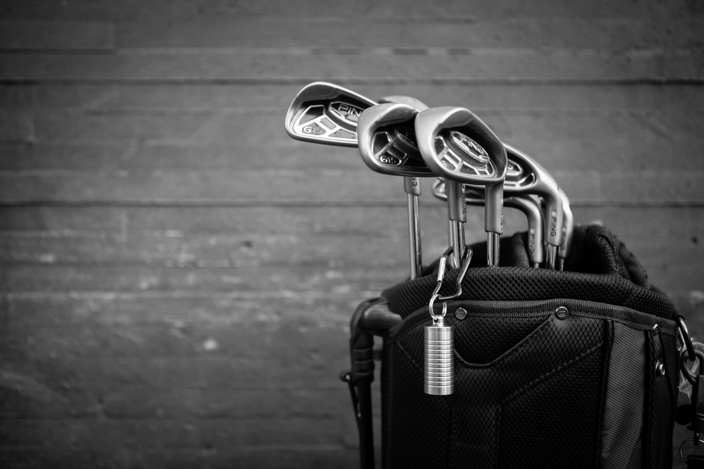 Cielo nitroglycerin bottle holder clipped to a golf bag
